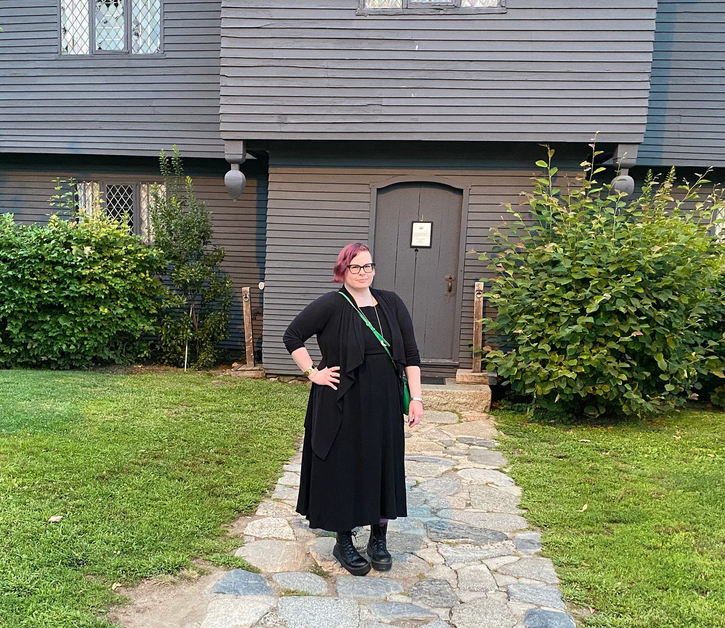 A photo of me standing outside the "Witch House" in Salem