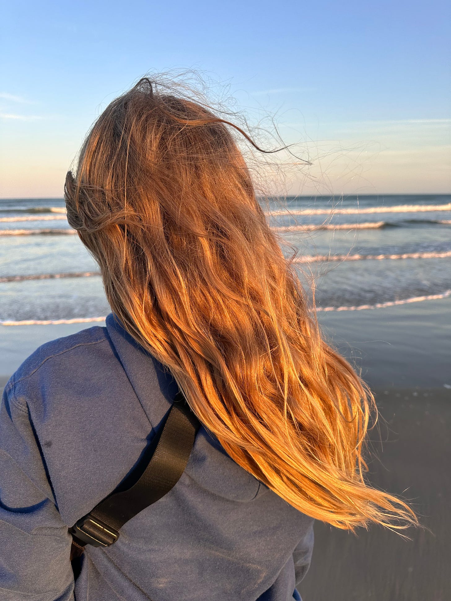 My daughter at Padre Island, backlit by the golden hour
