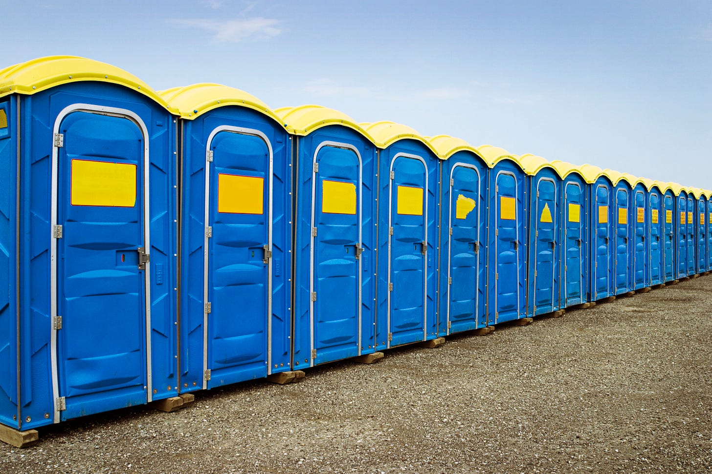 photo of porta-potties lined up next to each other