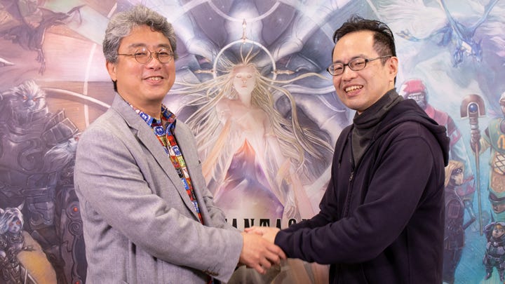 A photograph of Akihiko Matsui and Yoji Fujito shaking hands while smiling.