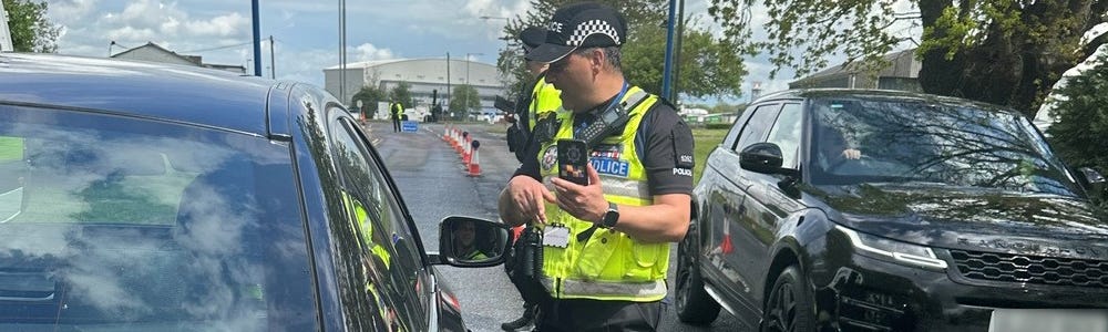 SC Paul Duke speaks to a driver at Stansted's vehicle check point