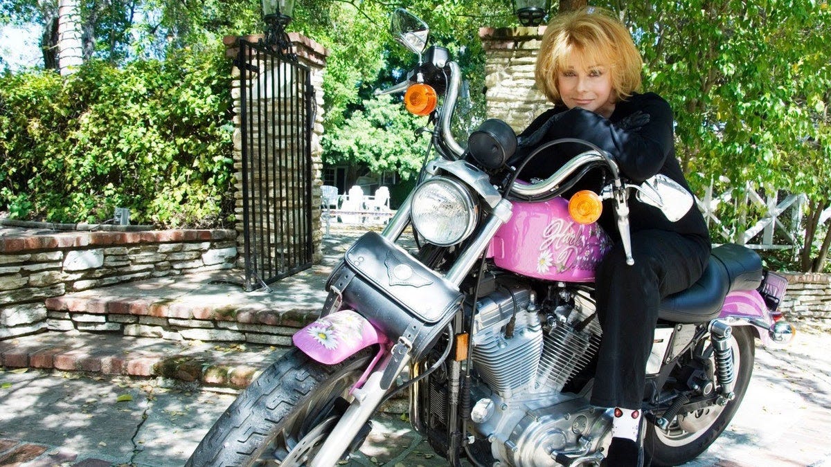 Ann-Margret on her pink Harley-Davidson