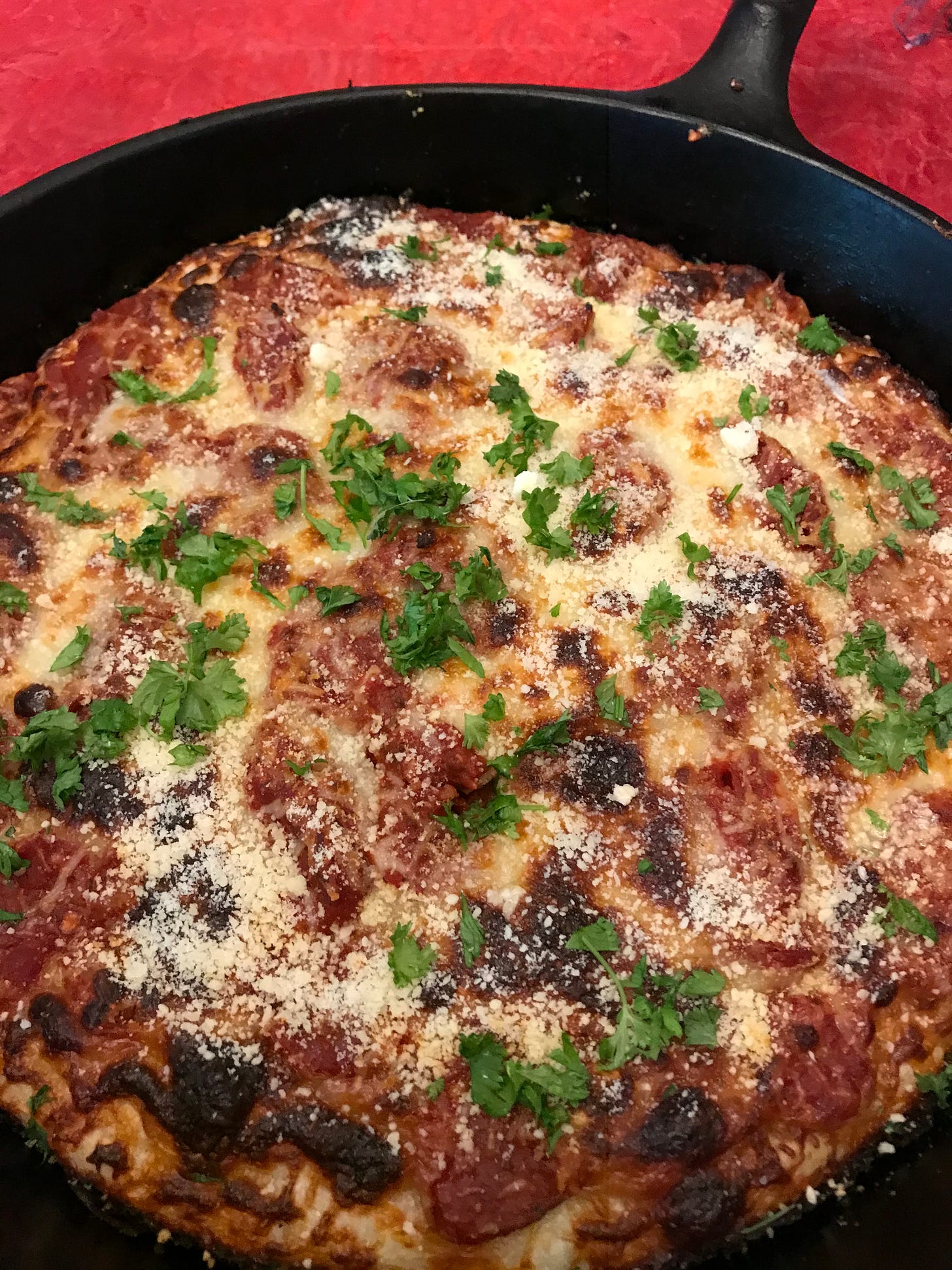 Homemade pizza in a cast iron skillet