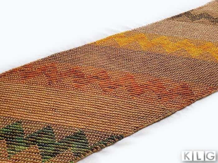 Kentia Wrap knitted by Jodie at Knit Like Granny featuring the mosaic sections in greens, orange and yellow
