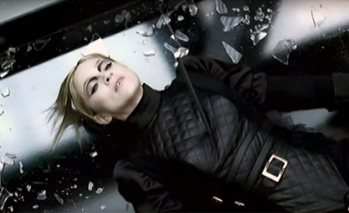 Madonna in a screenshot from Die Another Day collpased on the floor after a fencing match