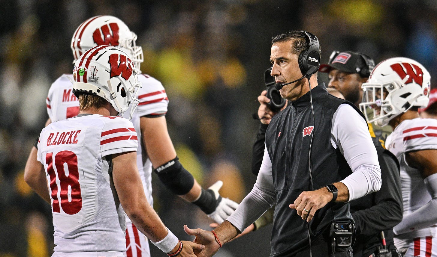 Wisconsin Badgers head coach Luke Fickell and Braedyn Locke against Iowa