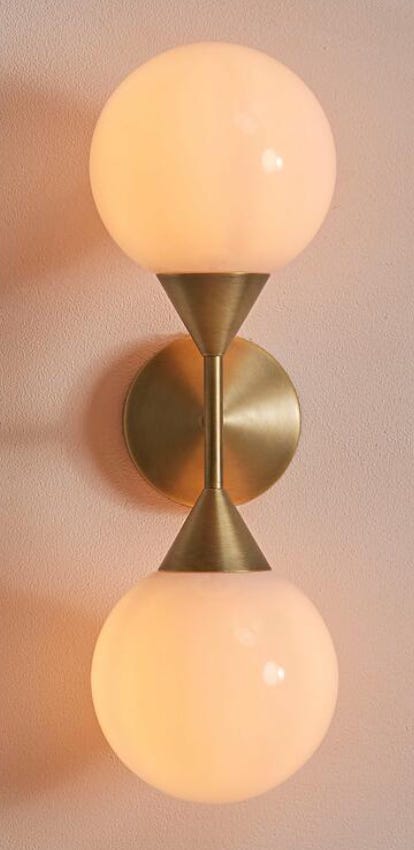 brass wall light with frosted dome glass light shade