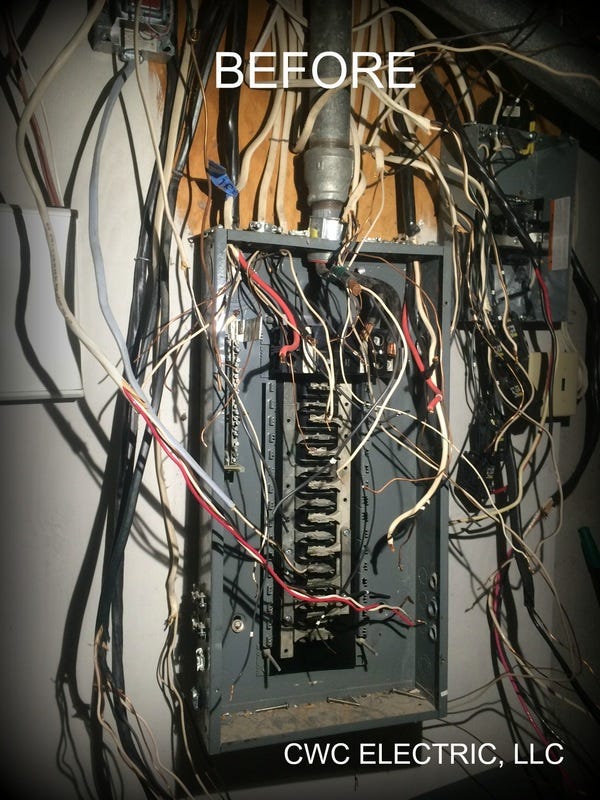 An electrical panel with wires all over the place.