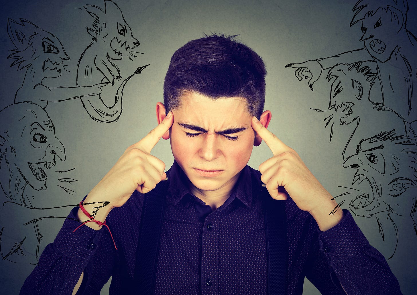A man stressed out with lots demons yelling at him