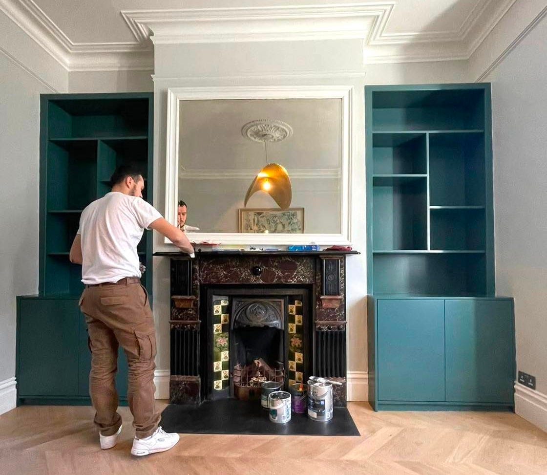 May be an image of 1 person, cooker hood, hearth and indoors