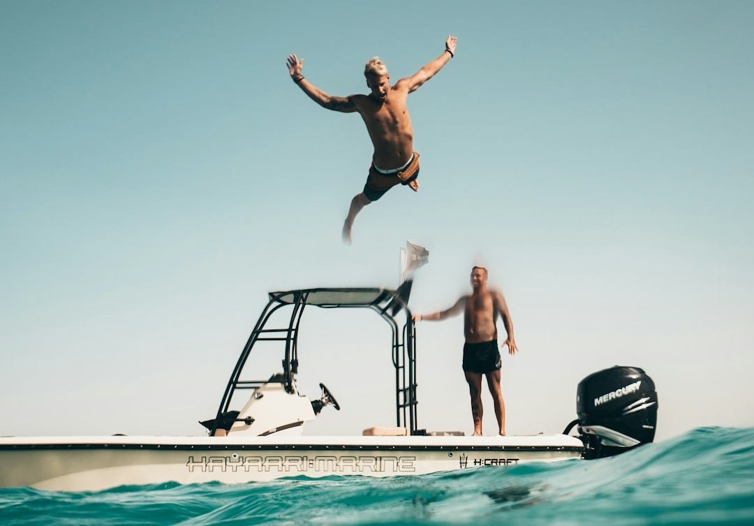 man diving on pool