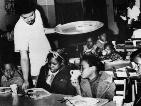 Bill Whitfield of the Black Panther party serves breakfast To local children in Kansas City, April 1969.