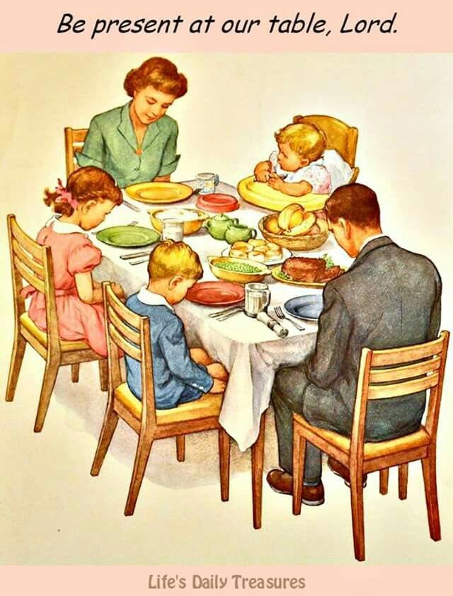 This may contain: a family sitting around a dinner table eating food