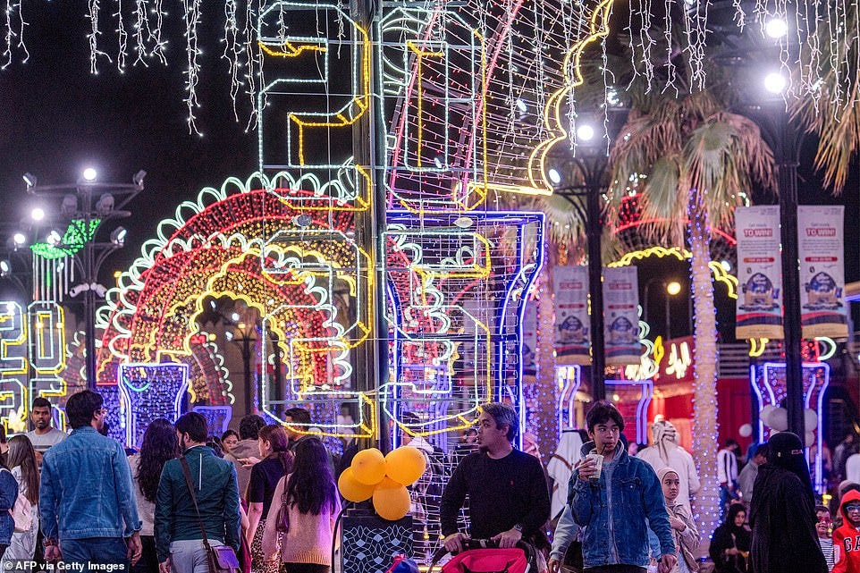 ABU DHABI: People walk at the Sheikh Zayed Heritage Festival as they await the New Years Eve fireworks and drone show in Abu Dhabi on December 31, 2024