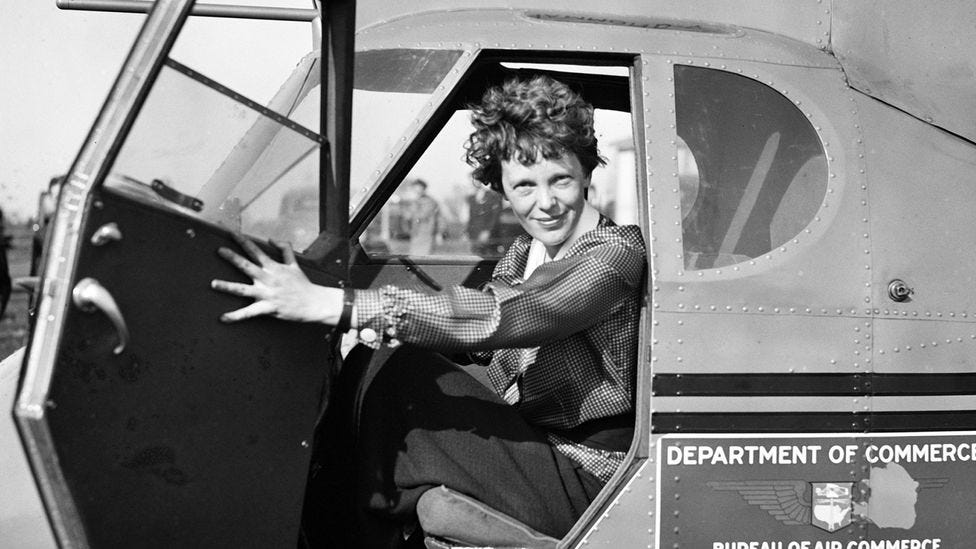 Pilot Amelia Earhart poses for a portrait in and aeroplane in circa 1936