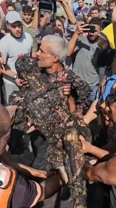 May be an image of 3 people, snake and crowd