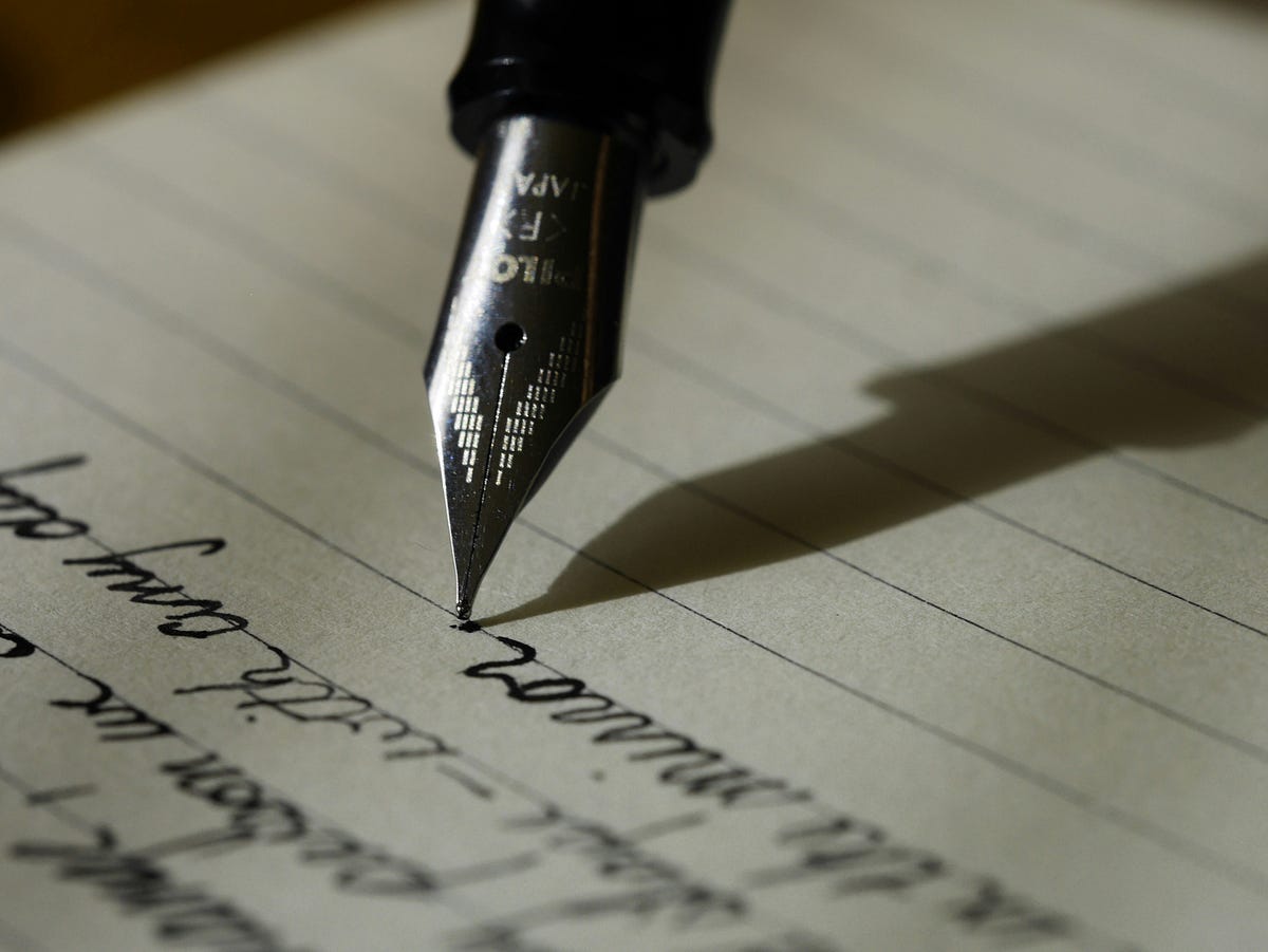 Words on paper written with a fountain pen. Words on paper written with a fountain pen.