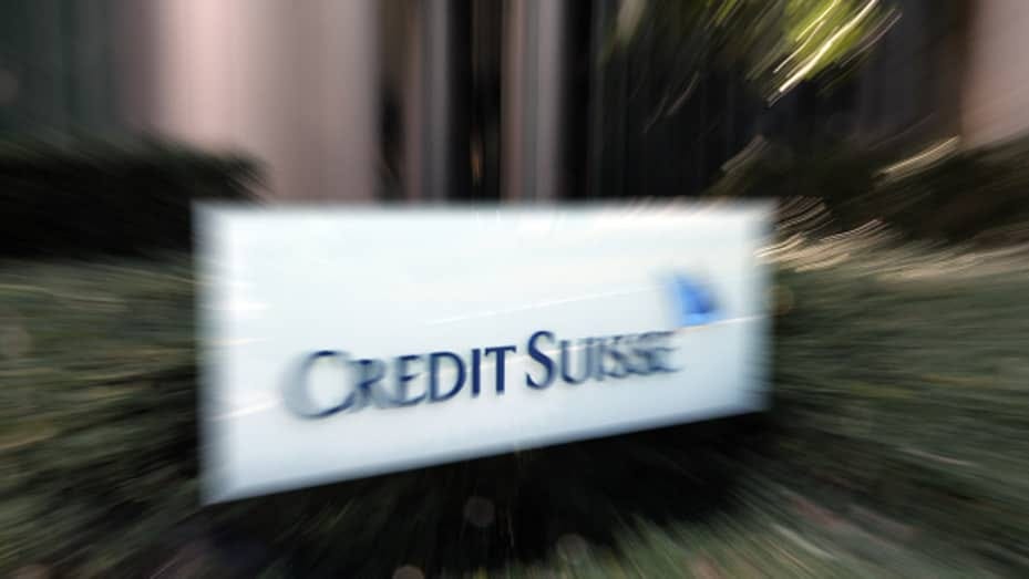 Signage for Credit Suisse Group AG outside a building, which houses the company's branch, in Tokyo, Japan, on Monday, March 20, 2023. UBS Group AG agreed to buy Credit Suisse Group in a historic, government-brokered deal aimed at containing a crisis of confidence that had started to spread across global financial markets.