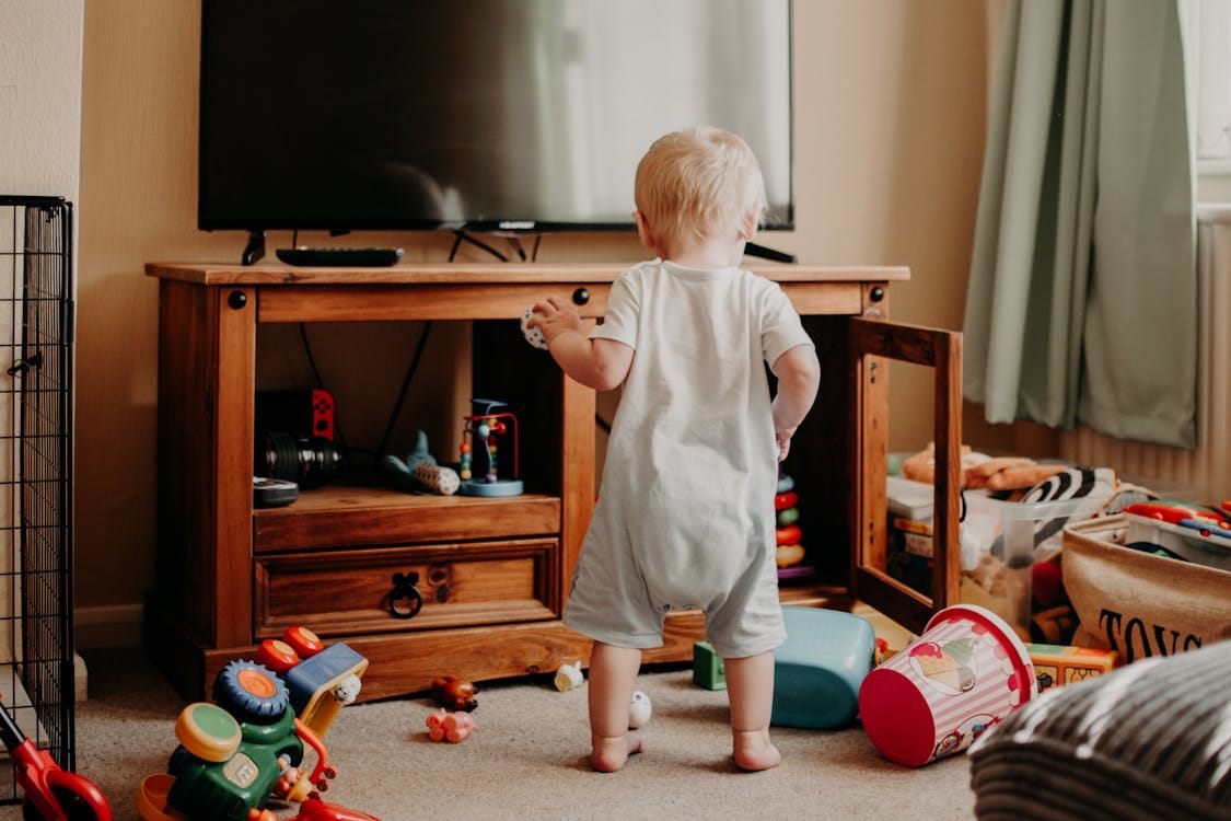 Free A Toddler Playing with  in the Room Stock Photo