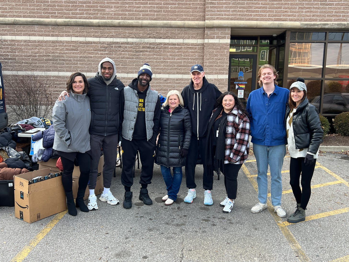 Nesmith, Pierce, Carlisle and members of the Horizon House board outside collecting coats.