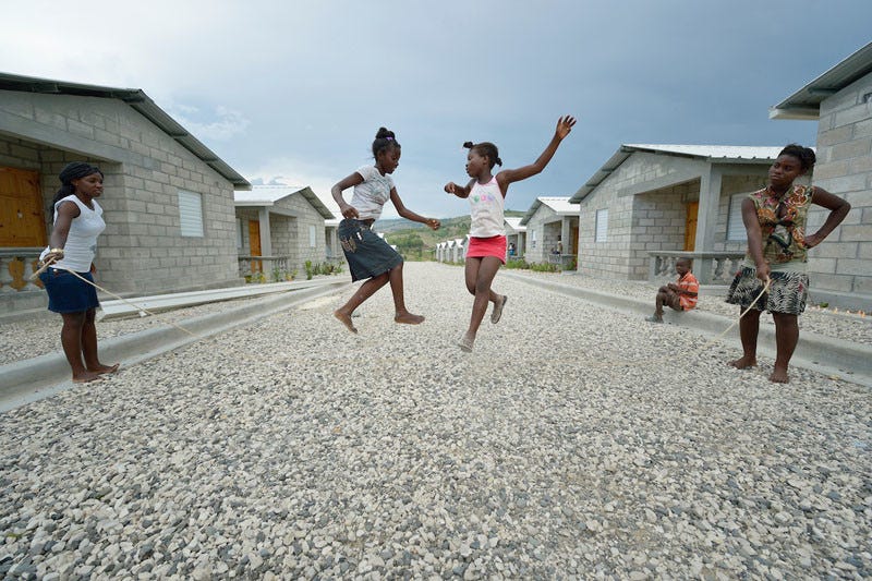 Children jump rope in 2013 in a model resettlement village constructed by the Lutheran World Federation in Gressier, Haiti. The settlement houses 150 families who were left homeless by the 2010 earthquake, and represents an intentional effort to "build back better," creating a sustainable and democratic community. Under "informed consent" rules that require prior approval, the photographer would have had to stop the girls from playing, have them identify their parents, explain the intricacies of "informed consent" and usage, get their signature, and then return to the street and photograph the girls at play. That's a process that's allegedly designed to assure that the girls are not depicted in an undignified manner. Photo by Paul Jeffrey. Children jump rope in 2013 in a model resettlement village constructed by the Lutheran World Federation in Gressier, Haiti. The settlement houses 150 families who were left homeless by the 2010 earthquake, and represents an intentional effort to "build back better," creating a sustainable and democratic community. Under "informed consent" rules that require prior approval, the photographer would have had to stop the girls from playing, have them identify their parents, explain the intricacies of "informed consent" and usage, get their signature, and then return to the street and photograph the girls at play. That's a process that's allegedly designed to assure that the girls are not depicted in an undignified manner. Photo by Paul Jeffrey.