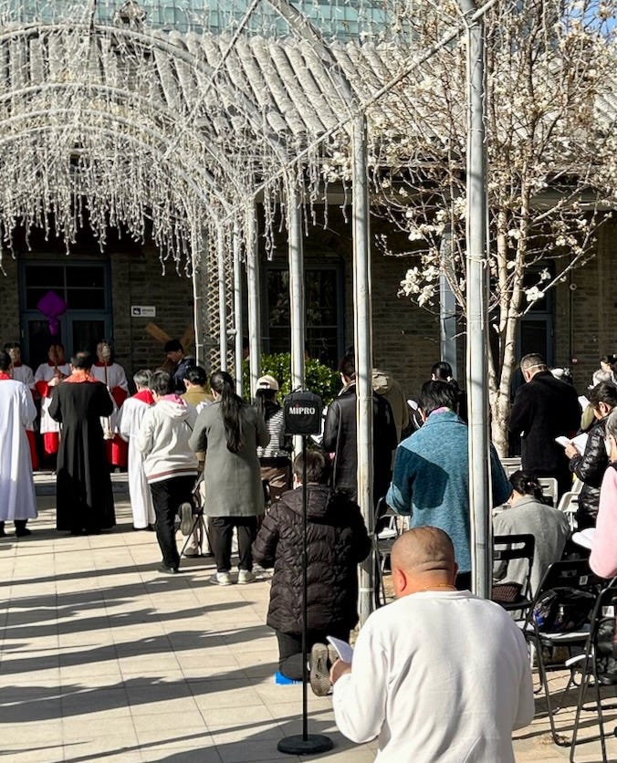 Church repairs mean Stations of the Cross on Good Friday was moved to the church courtyard. People of all ages participated.