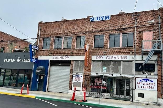 A brick building with a garage door