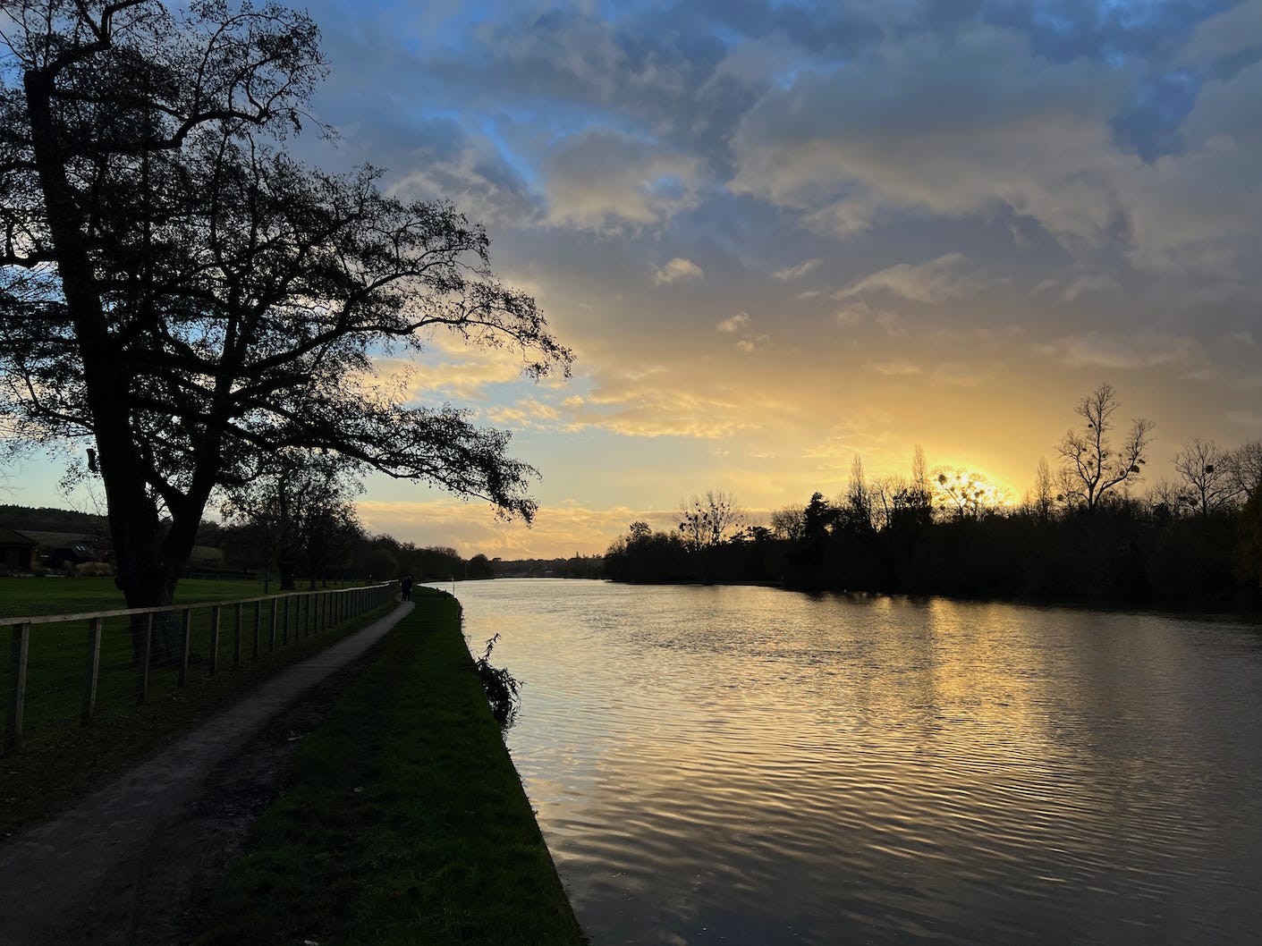 A photograph of sunset over a river — is retirement walking off into the sunset?