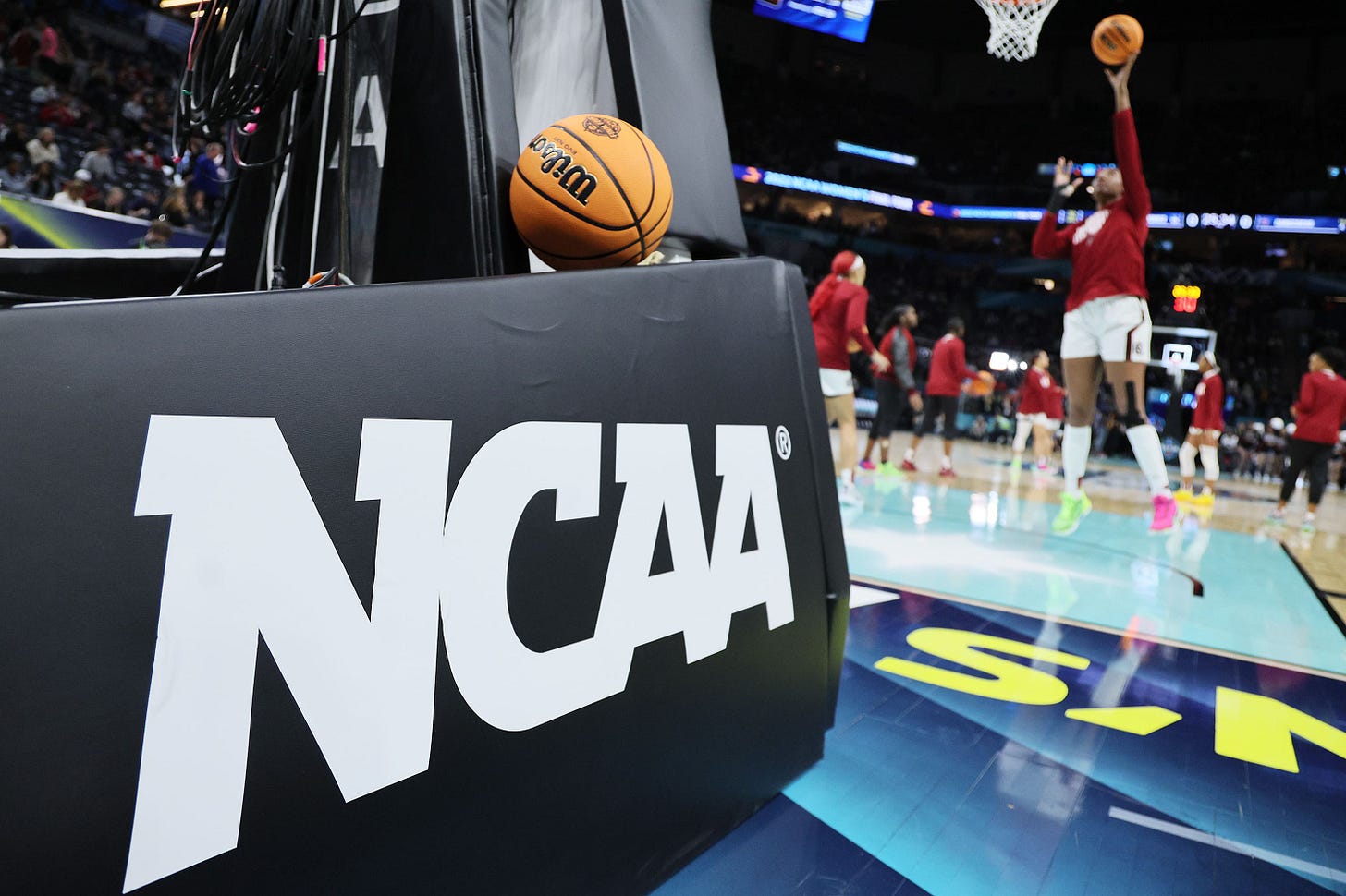 U.S. judge approves settlement allowing NCAA schools to pay athletes
