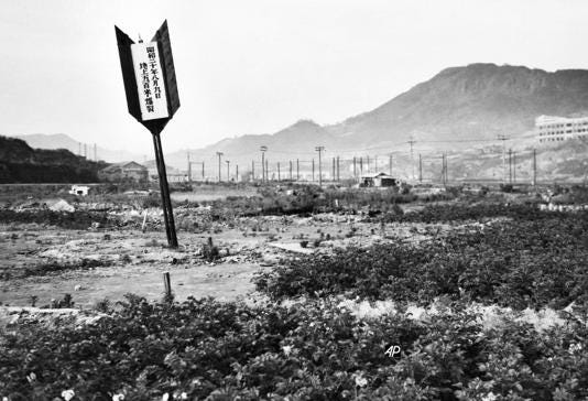Arrow marks the spot where the atomic bomb struck at Nagasaki, Japan, August 10, 1945.