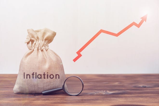 A red charting arrow pointing upward, next to a money bag marked with the word Inflation.