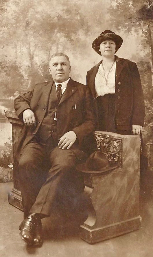 Middle aged couple pose for a wedding photo in the 1920s Middle aged couple pose for a wedding photo in the 1920s