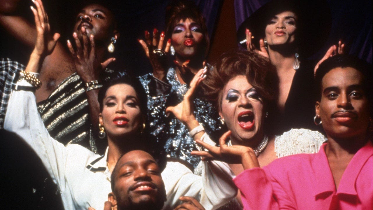 Movie still from Paris is Burning. A group of dancers pose.