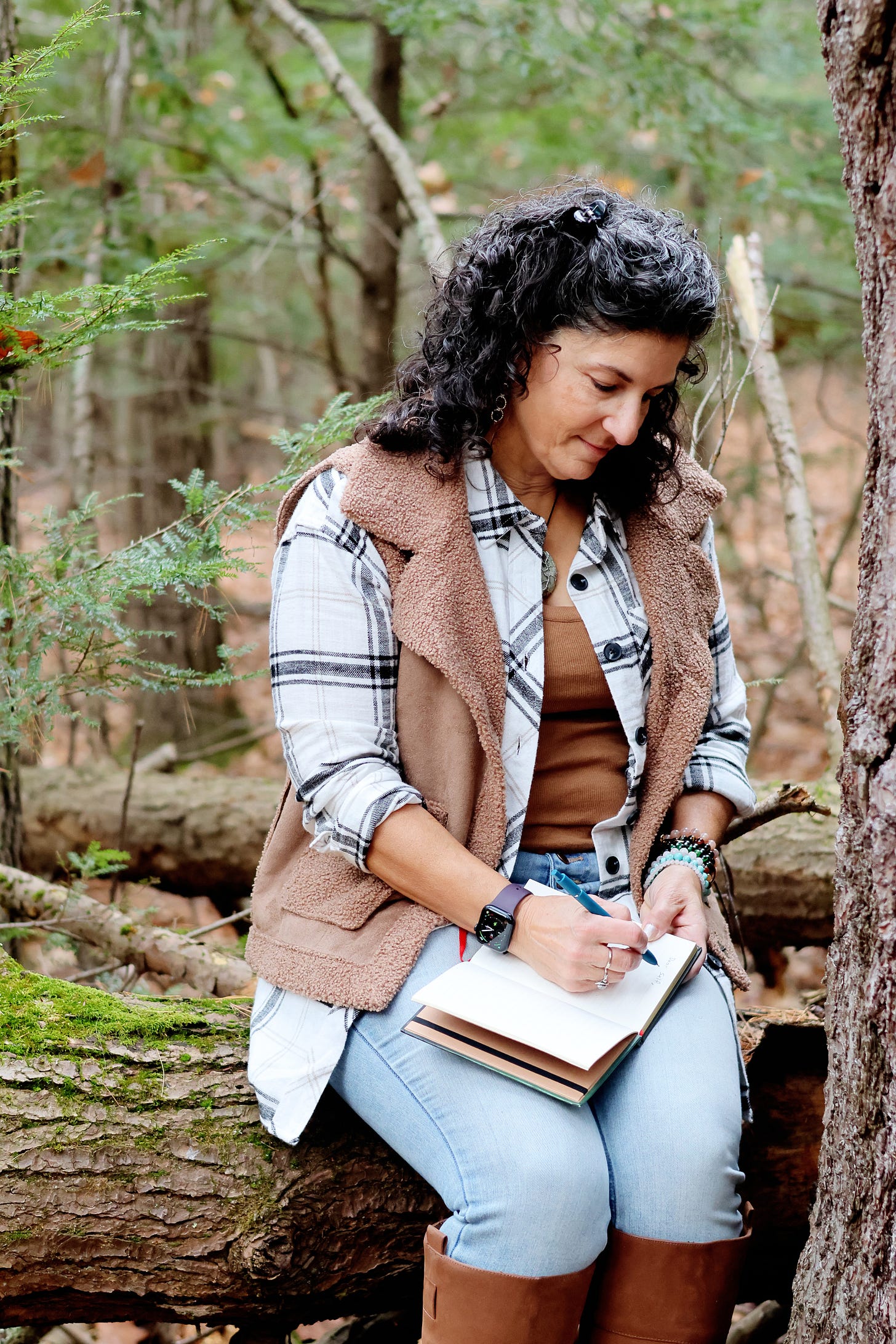 woman writing in a journal