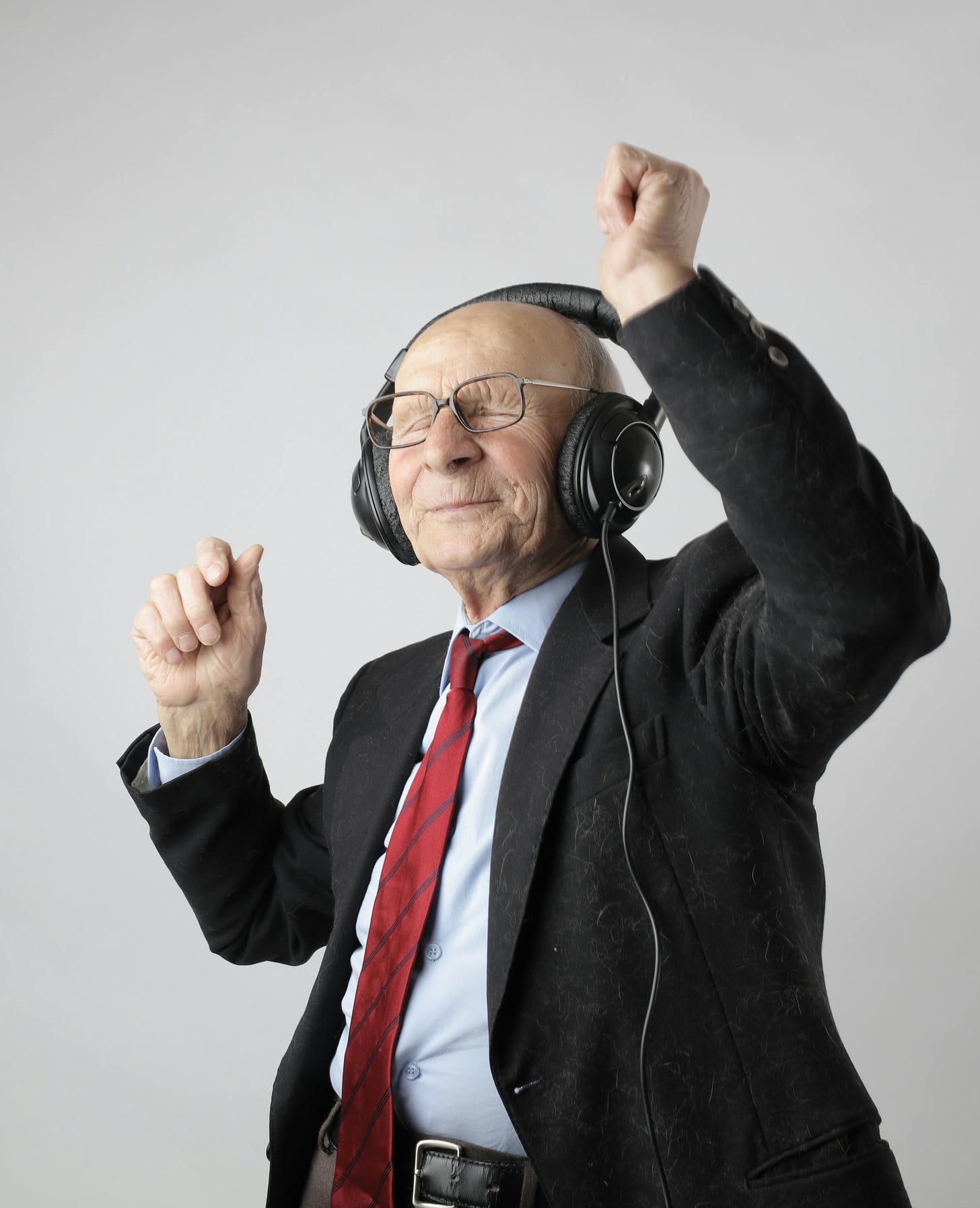 Man smiling and dancing in headphones