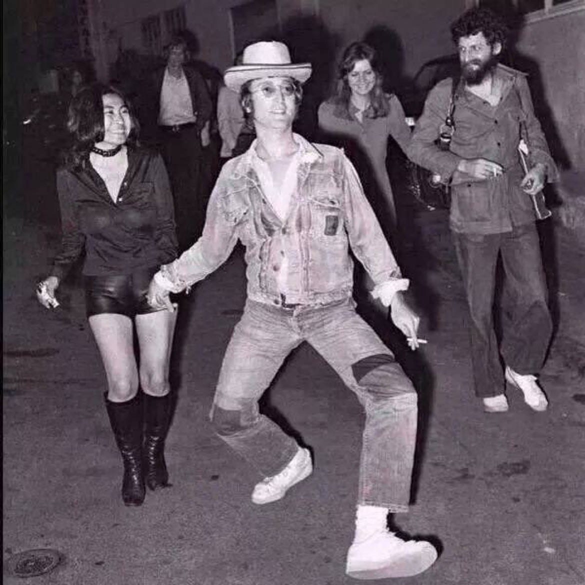 What's with this picture of John Lennon? Why is he walking ...