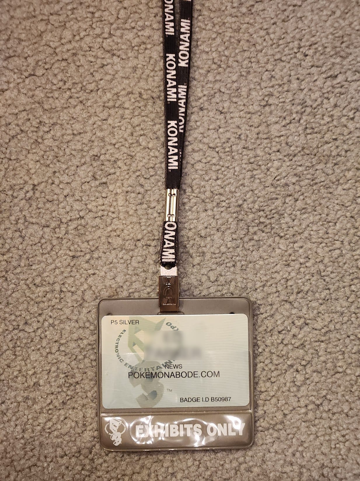 An E3 Pass on a lanyard, used to represent Pokémon Abode