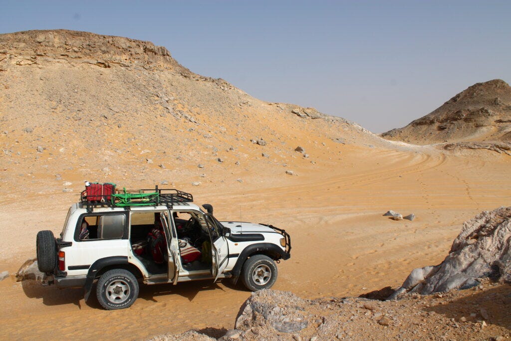 Jeep parked next to Crystal Mountain on White Desert Tour.