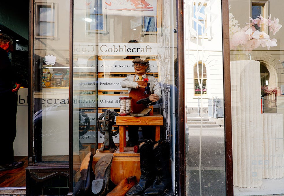 another animatronic cobbler in the window