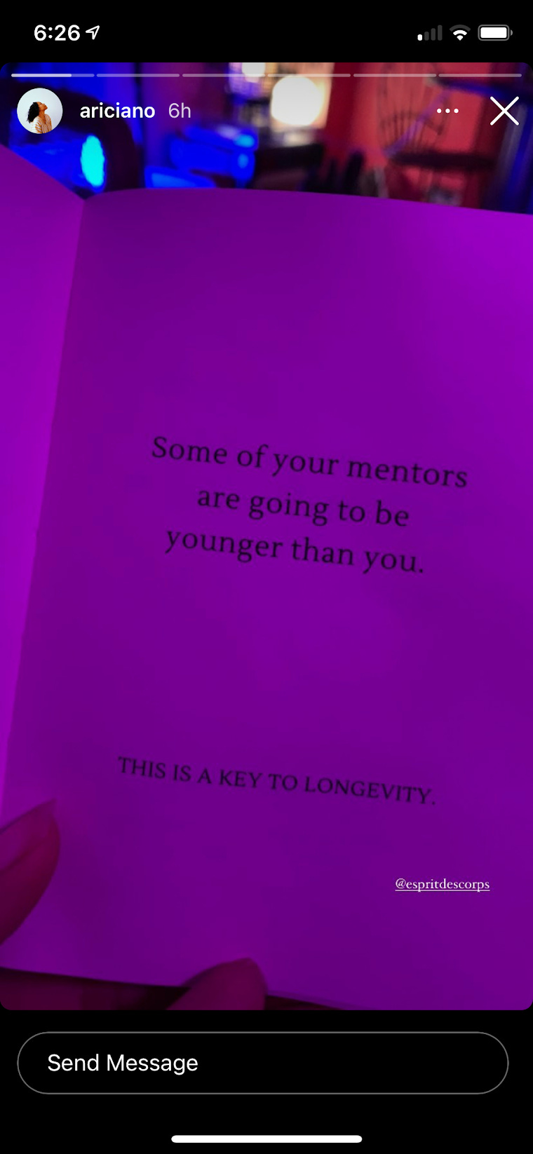 Close-up photo of an open book under a purple light with the text, “Some of your mentors are going to be younger than you. This is a key to longevity.”