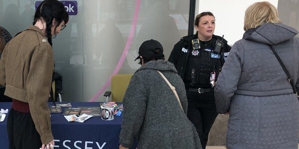 Officer advising members of the public about the dangers of drink spiking