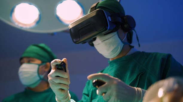 Future medical innovations. Professional surgeons in  uniform and VR headset performing operation on patient in modern clinic. virtual reality stock pictures, royalty-free photos & images