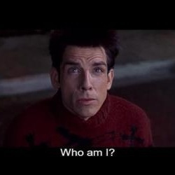This may contain: a man in a red sweater with the words who am i?