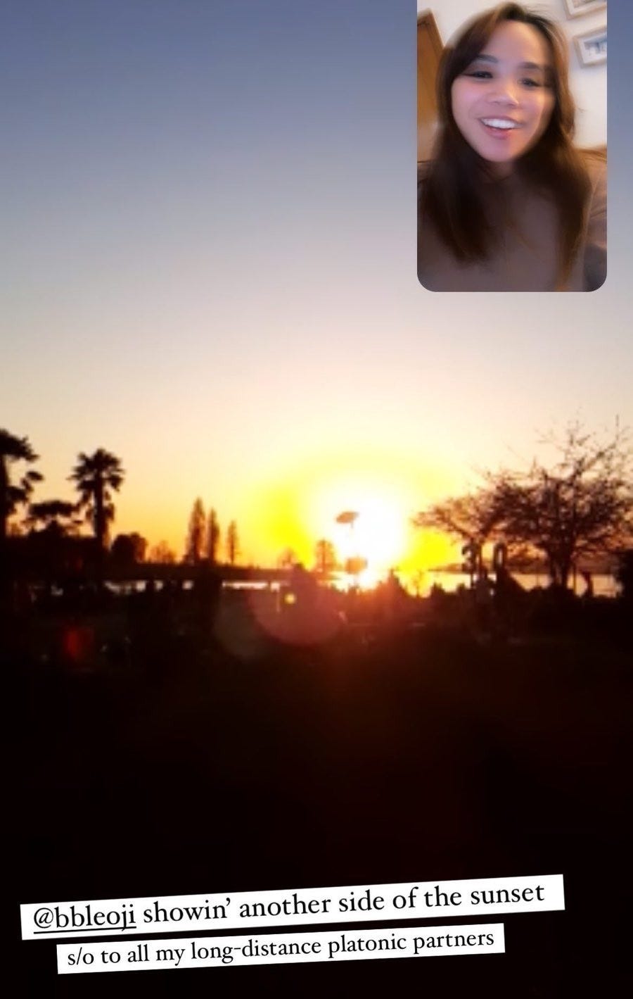 A dual photo screenshot of a video call. One small photo of Gabes' face in the top right corner and the larger photo is of a sunset in so-called Vancouver. Text reads @bbleoji showin' another side of the sunset. s/o to all my long-distance platonic partners.