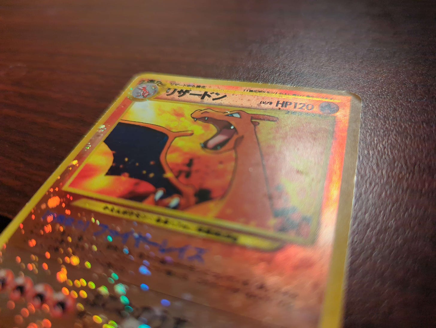 A close-up shot of Aiden’s cherished Charizard card