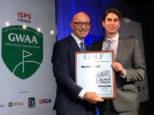 Accepting some hardware at the Golf Writers awards dinner, which Tim Rosaforte often hosted.