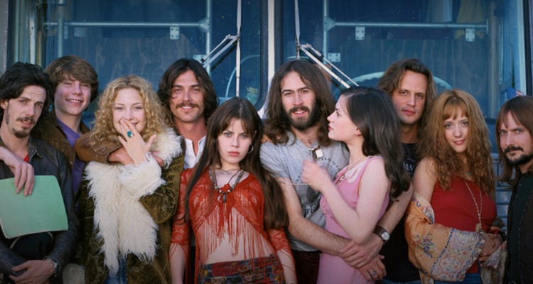 The cast of Almost Famous in front of Stillwater's tour bus.