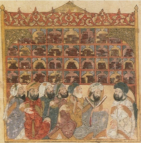 Artwork of scholars at an Abbasid library. Seven men sit in front of a bookshelf; one man is reading from an opened book.