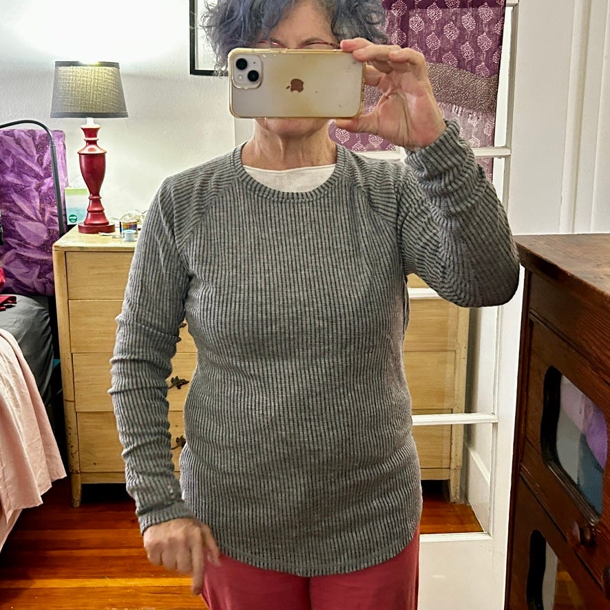 Author wearing amazing thrift store sweater find