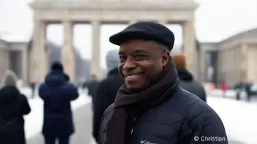 Akinola Famson from the Africa Central Council poses for a photo in front of the Brandenburg Gate in Berlin. Akinola Famson from the Africa Central Council poses for a photo in front of the Brandenburg Gate in Berlin.